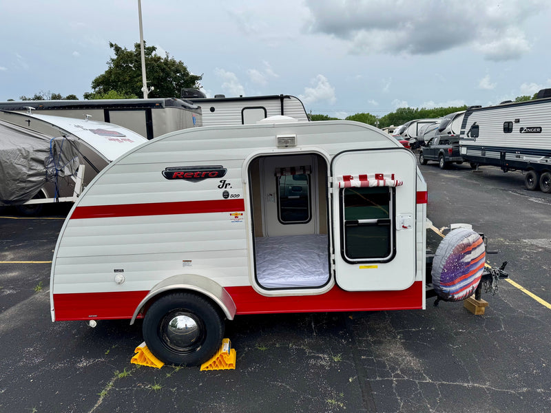  ideal for your next rv rental adventure with classic vintage style.|A white and red Retro Jr. teardrop rv rental with its door open — photo 2