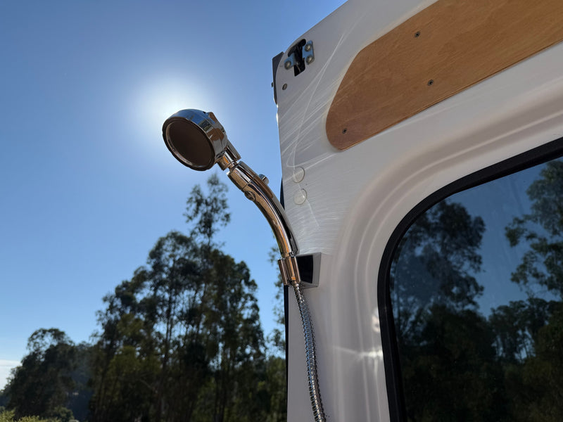 Outdoor shower setup on an RV rental, perfect for cleaning off after adventures. Sun shines on the chrome fixture. — photo 18