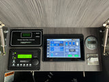 RV rental digital control panel: detailed view of power, tank levels, climate, and charging systems for monitoring and management.