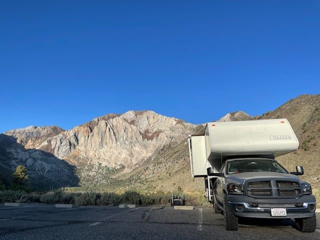  a truck camper on a grey pickup — photo 2