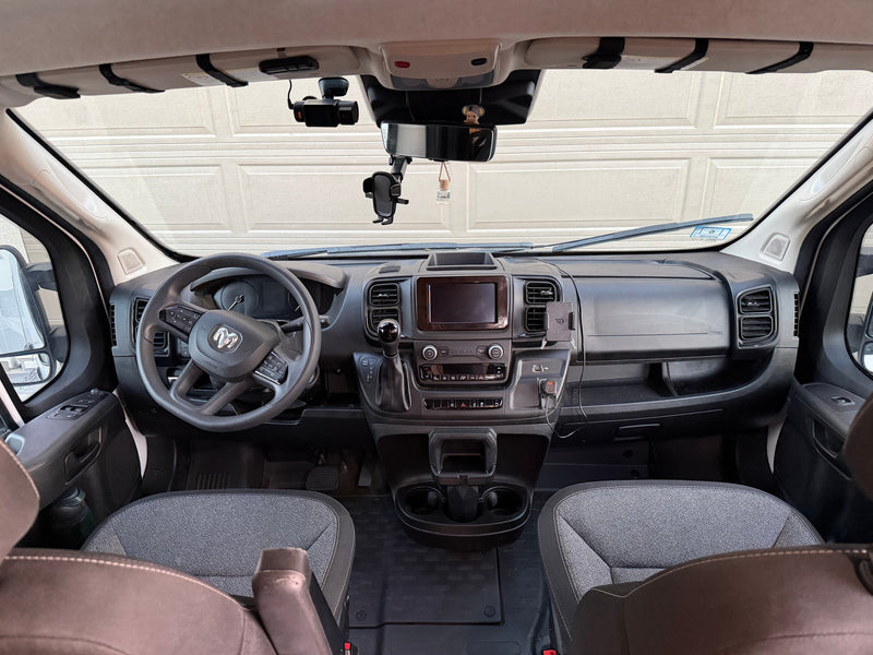 The spacious cockpit of an RV rental, showing the dashboard, steering wheel, and seats, ready for a journey. — photo 19