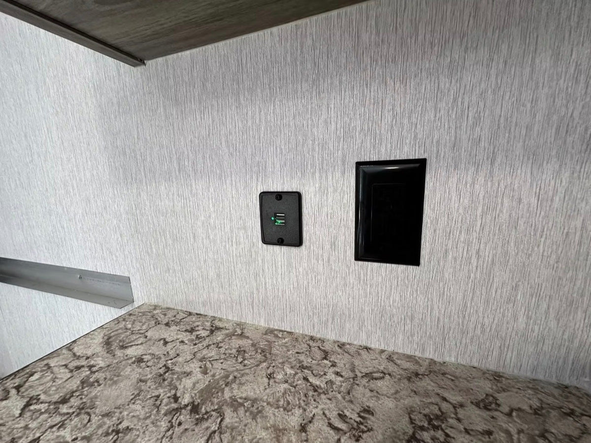  and wall-mounted AC unit.|Inside this RV rental: compact interior with bench seating — photo 11