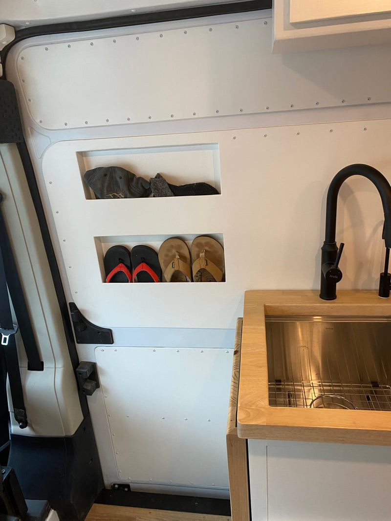 Inside this camper van RV rental: smart built-in storage for items like shoes & hats, plus a compact kitchen sink. — photo 14
