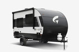 Compact black & white travel trailer, a perfect RV rental for your off-grid camping adventure.