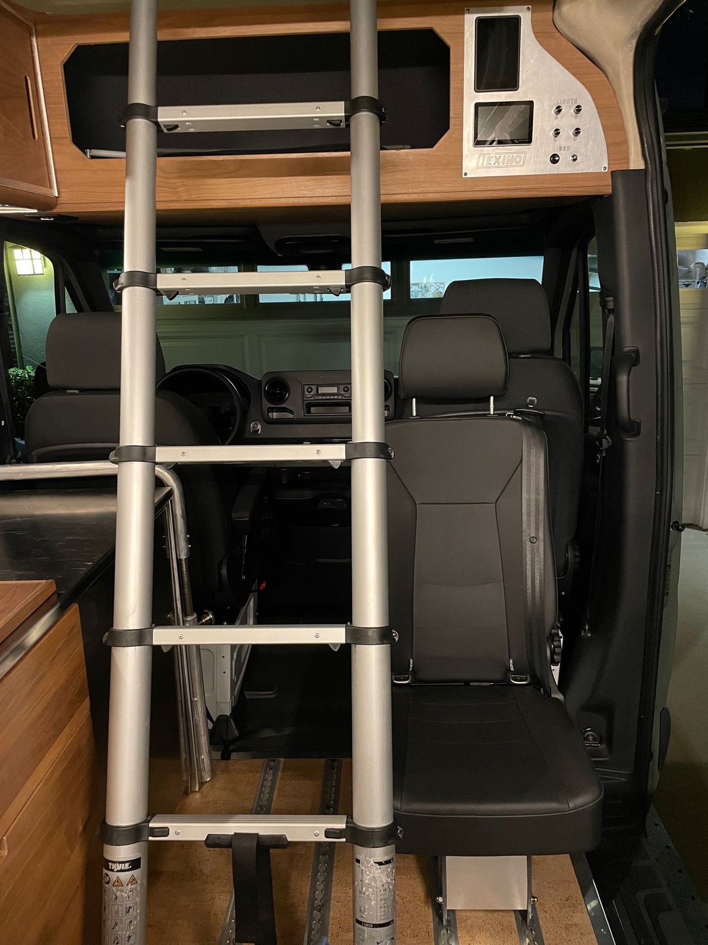  and window.|RV rental: Modern camper kitchen with sink — photo 6