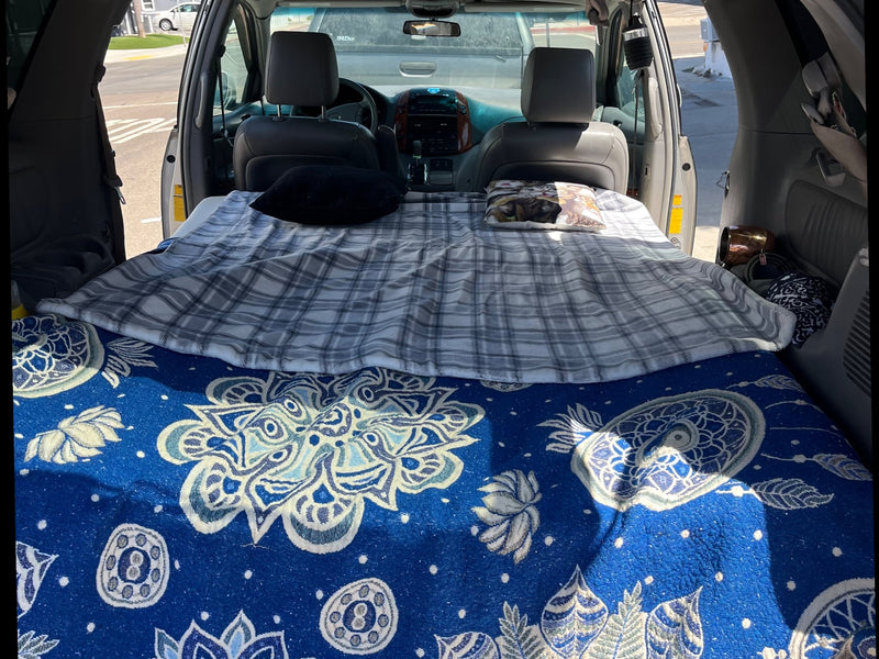  parked by a stop sign.|Van's rear cargo area with a custom wooden platform — photo 5