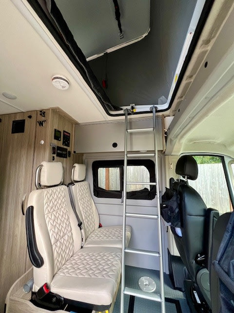  and clean floor mats. Ready for travel.|Driver's view of a spacious RV rental interior: Ram steering wheel — photo 7