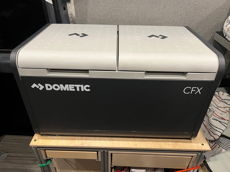 Dometic CFX portable fridge/cooler in an RV rental setup, keeping food fresh for van life adventures. — photo 19