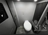 Sleek and compact RV rental bathroom featuring a white toilet, essential for comfortable travel.