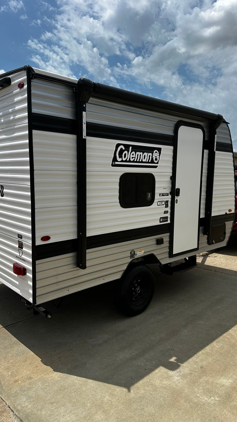  ready for adventure. This sleek camper is parked on concrete under a blue sky — photo 2