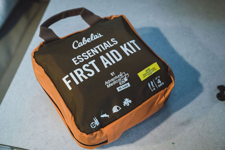 Cabela's First Aid Kit, crucial for any RV rental or outdoor adventure. Covers 1-4 people for up to 4 days.