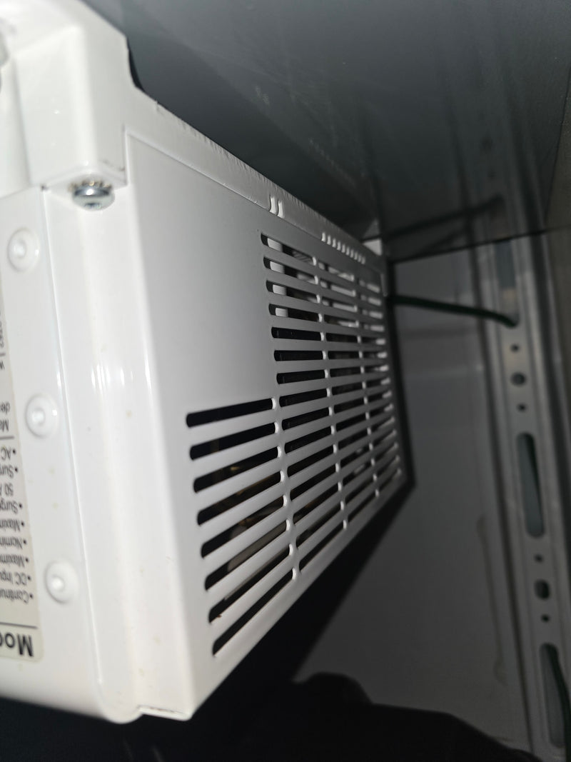  possibly for rv rental. Chrome shelving unit holds supplies; black textured floor.|Robust rv rental power system: dual Deka batteries — photo 13