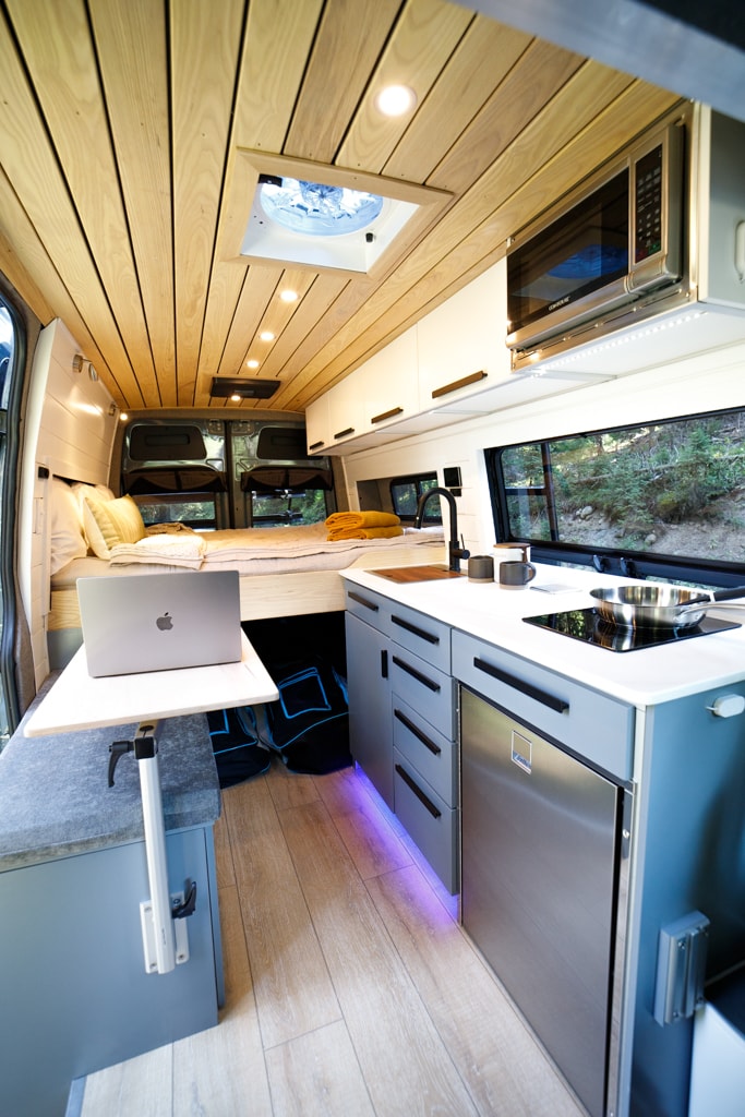  visible from open rear doors.|Explore this modern rv rental's interior: wood ceiling — photo 13