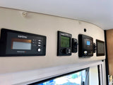 RV rental's control center: Xantrex inverter, Truma heater, & battery monitor. Vital systems for an RV adventure.