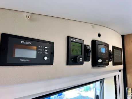 RV rental's control center: Xantrex inverter, Truma heater, & battery monitor. Vital systems for an RV adventure.