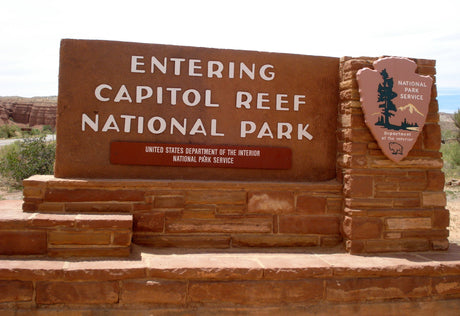 Capitol Reef National Park entrance sign. Start your RV rental adventure at this stunning national park!