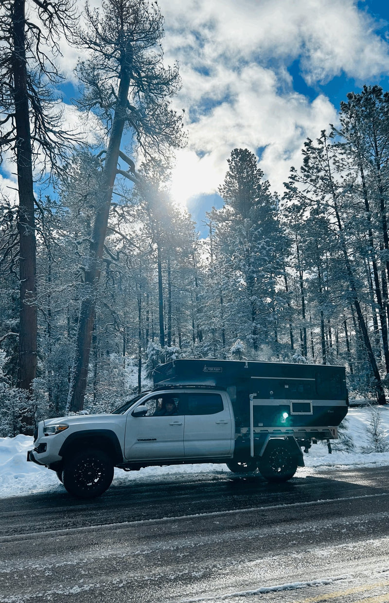  ideal for rv rental adventures or camping trips.|White Toyota Tacoma with Four Wheel camper — photo 12