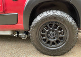 Rugged BFGoodrich tires & Black Rhino wheels on an RV rental. Note the gray waste tank drain below the side door.