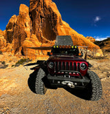This rugged Jeep off-road vehicle with an awning is perfect for desert adventures. Explore red rock formations with an rv rental!