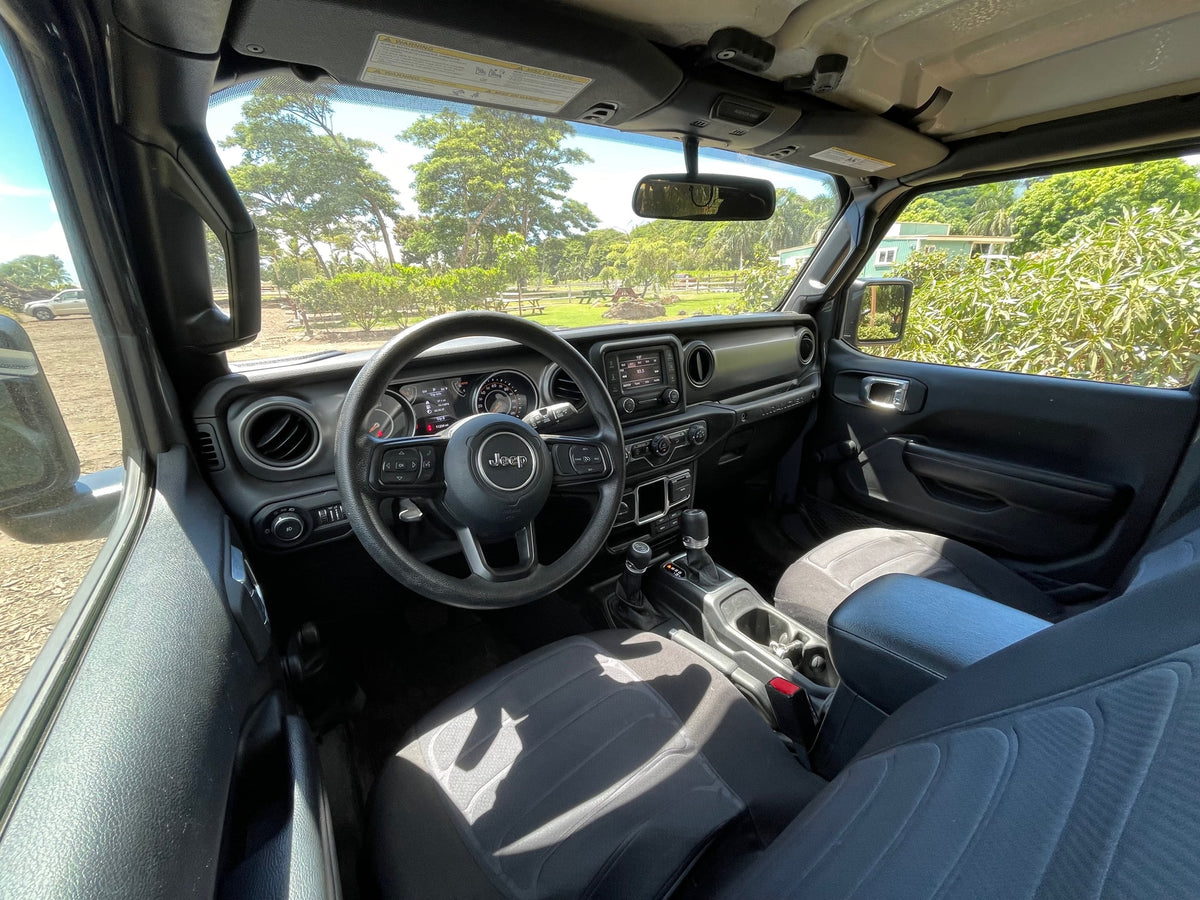 Jeep Wrangler interior, ready for adventure. A great choice over an RV rental, overlooking a scenic park. — photo 9