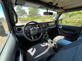 Jeep Wrangler interior, ready for adventure. A great choice over an RV rental, overlooking a scenic park.