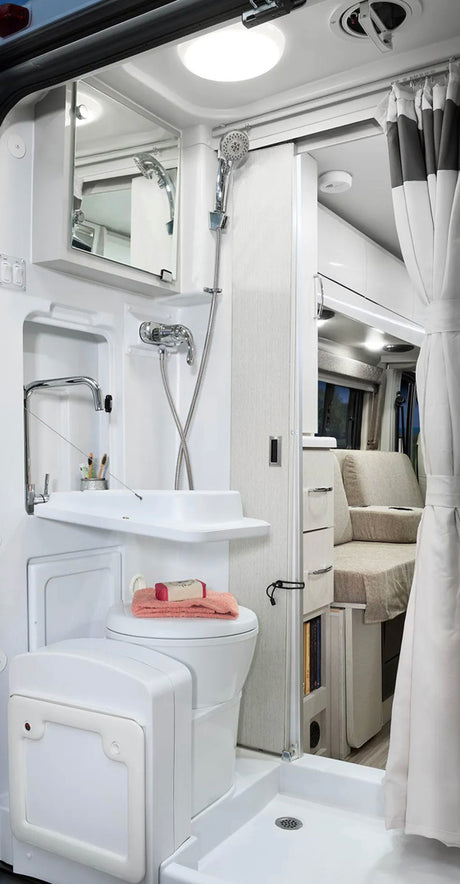 This RV rental's compact wet bath includes a toilet, fold-down sink, and shower for maximizing space.