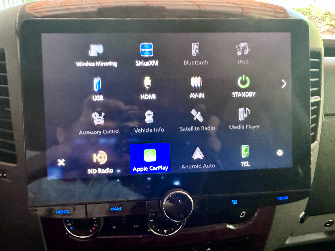 RV rental dashboard display shows Apple CarPlay, Android Auto, SiriusXM, & multimedia features for your journey.