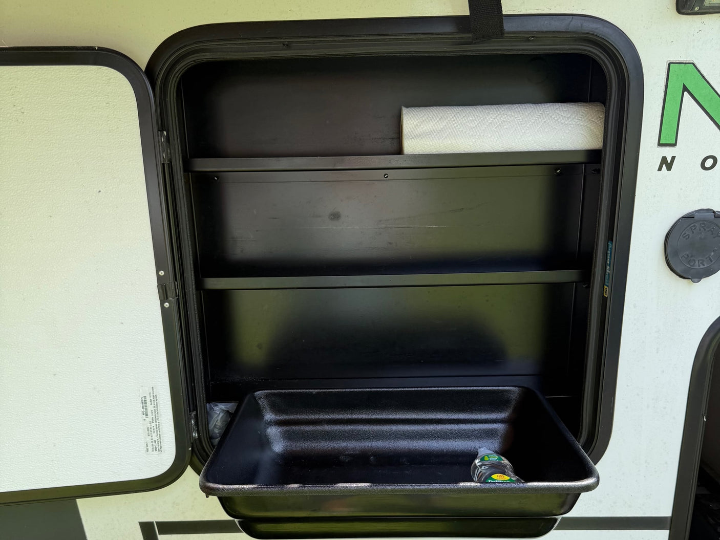  featuring a two-burner Suburban gas stove and bottle opener