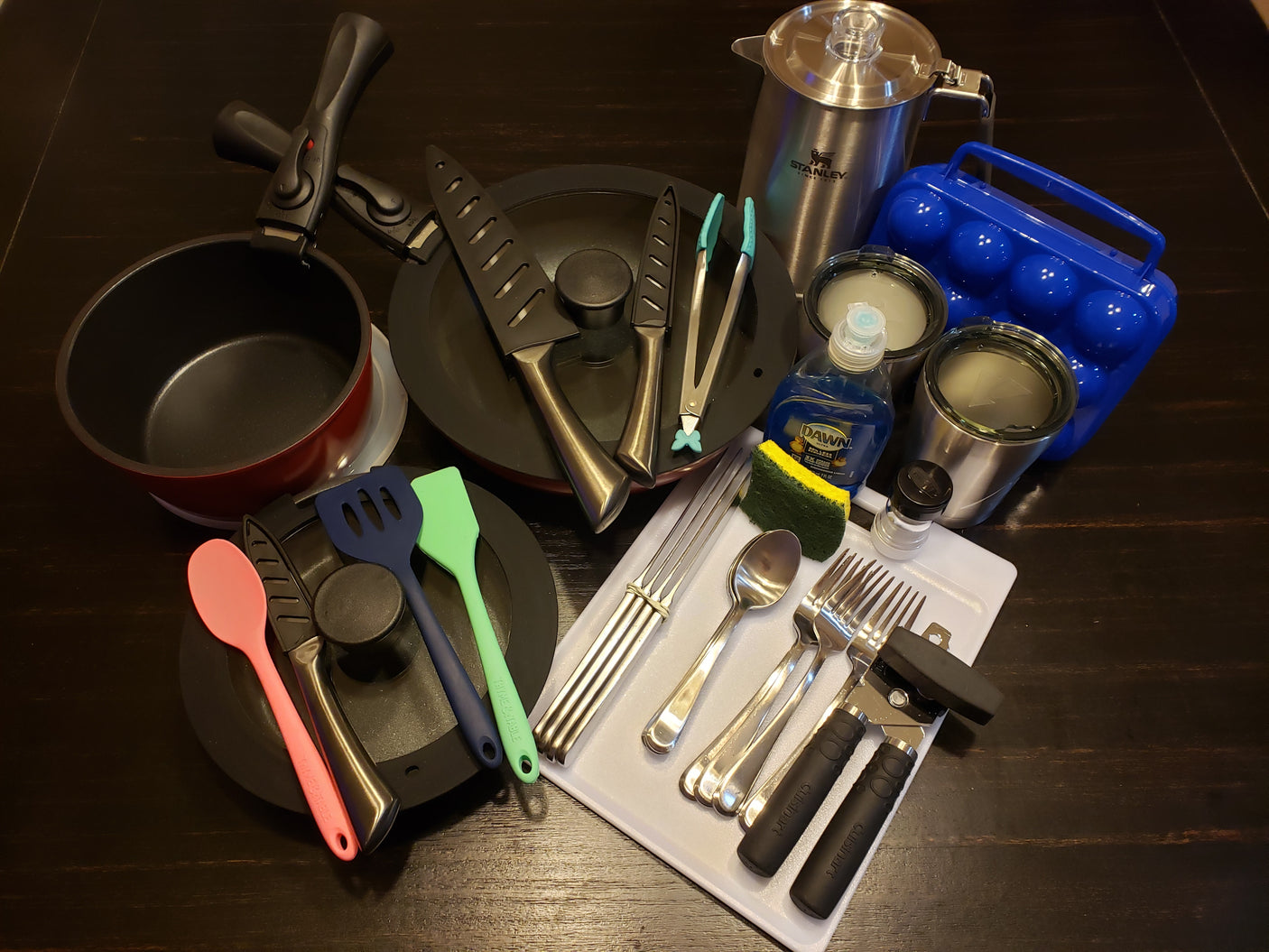 RV rental essentials: pots, pans, tools, cutlery, and cleaning supplies for your camp kitchen.