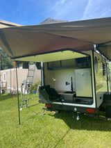 RV rental with an amazing outdoor kitchen featuring a pull-out stove, sink, and fridge for easy camping.