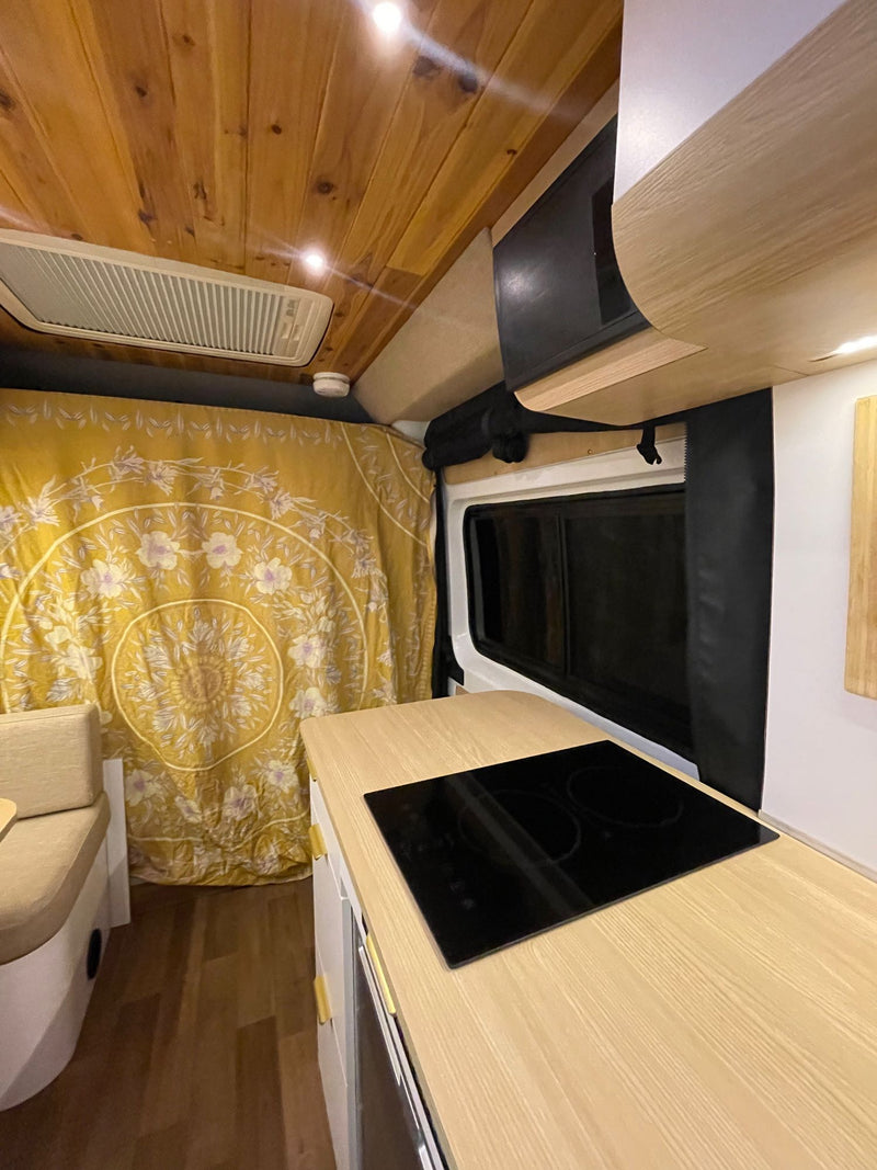  and vibrant yellow tapestry.|Efficient kitchen storage in an RV rental! Plates — photo 11