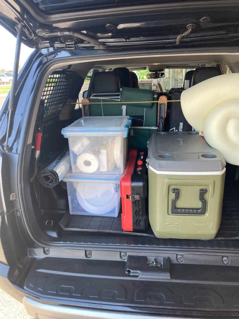 Packed SUV trunk ready for adventure, featuring cooler, stove, and camping gear—a compact RV rental alternative. — photo 12
