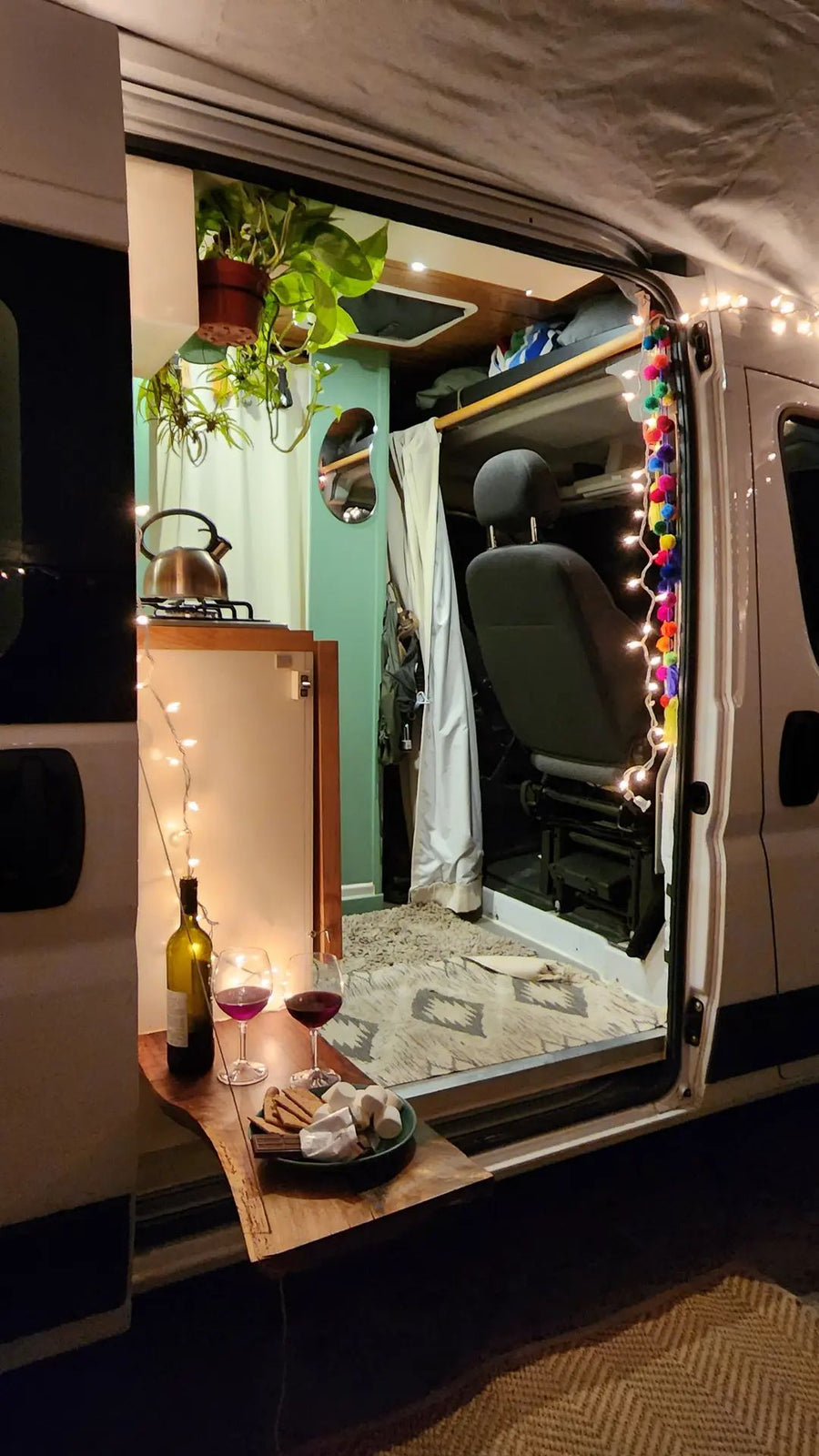  and a black shower setup. Ideal for space-saving.|Cozy RV rental interior with bed