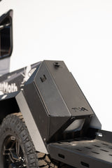 Close-up of a SaberMoth RV rental's rugged TAYA storage box, off-road fender, and tire.