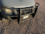 Textured gray Mercedes-Benz Sprinter rv rental with a heavy-duty brush guard, Arizona license plate, and off-road tires.