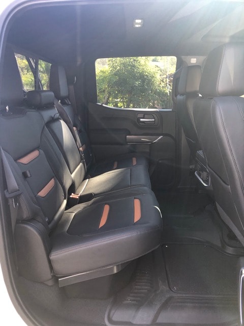  with an ocean view in the background. Perfect for RV rental adventures.|Inside a GMC truck: steering wheel