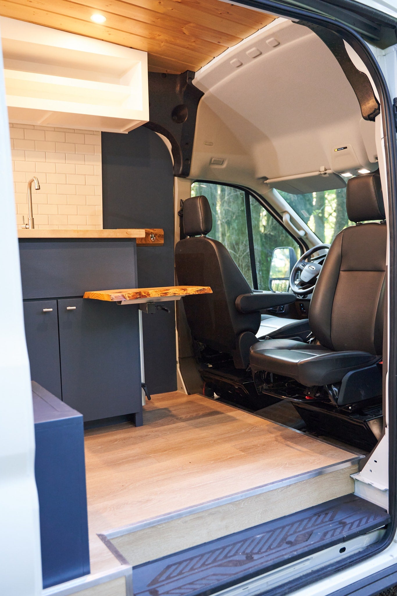  ready for adventure.|Rear view of a white rv rental camper van parked on a gravel forest path — photo 5