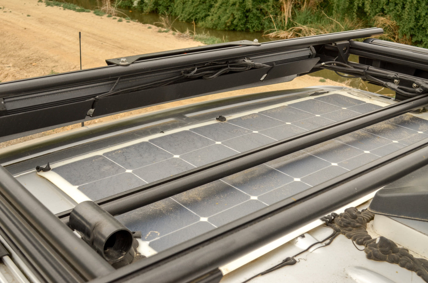 Rooftop solar panels on an RV rental, showcasing sustainable power for remote travel and outdoor living.