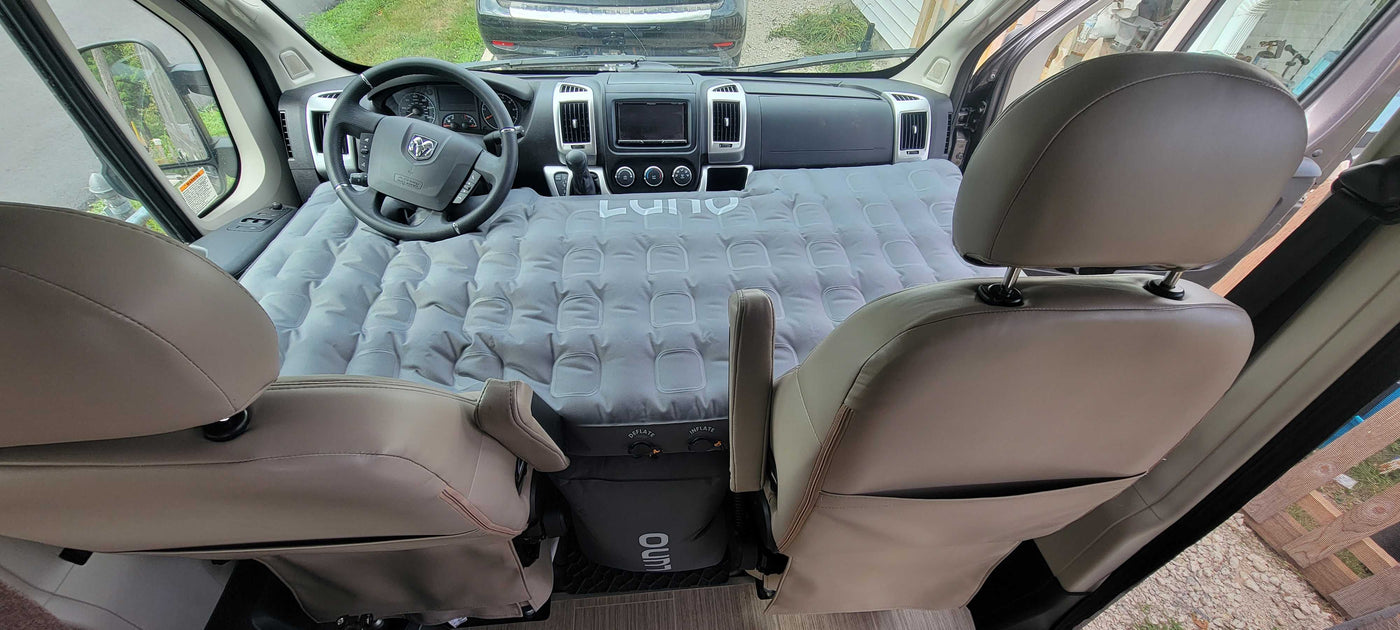 Inside an RV rental: a Luno air mattress seamlessly converts the front cabin into a cozy sleeping area for your next adventure. — photo 17