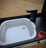 RV rental ready: Dometic portable faucet & collapsible sink for convenient outdoor dishwashing, perfect for camping hygiene.