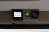RV rental control panel showing Truma system, battery monitor (100% SOC), and CombiMaster inverter data.
