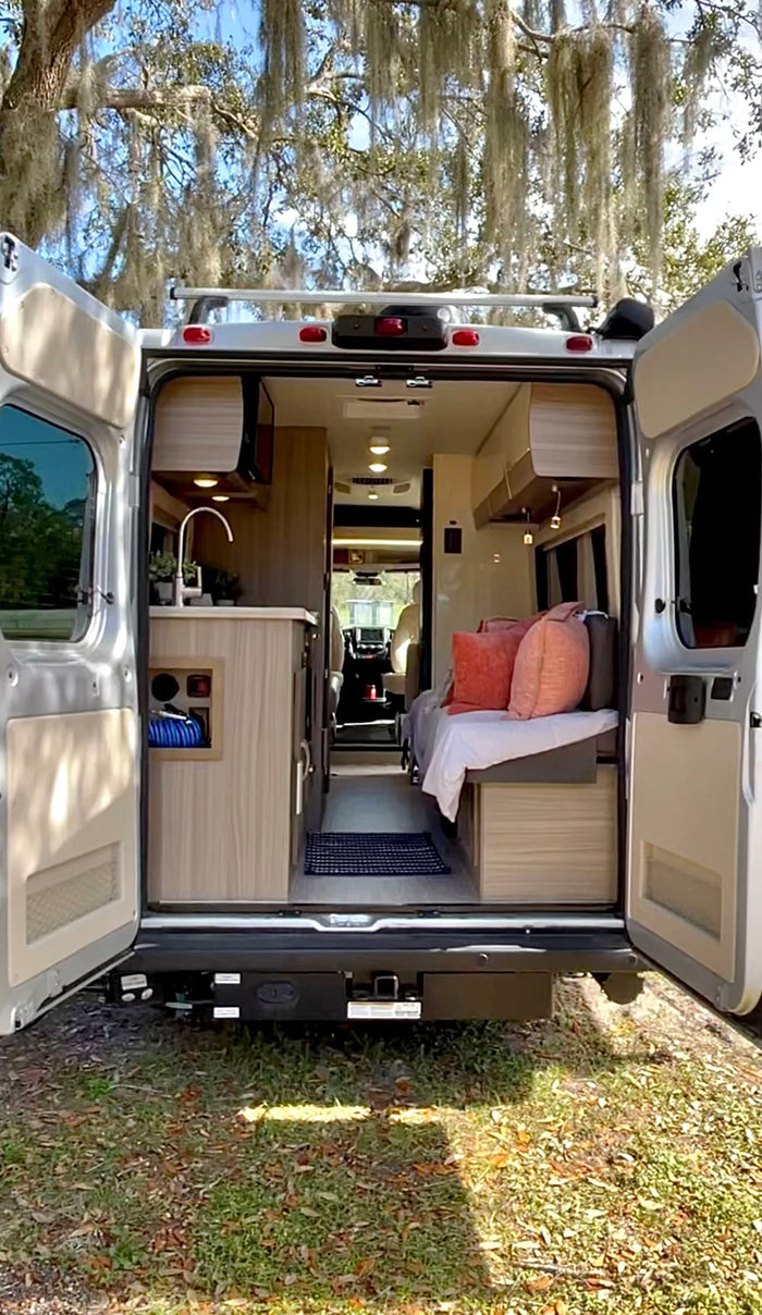  captured with an RV rental reflection. Adventure awaits!|An rv rental is parked on a winding road