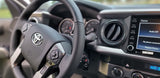 RV rental: Toyota dashboard interior showing steering wheel, infotainment system, and climate controls.