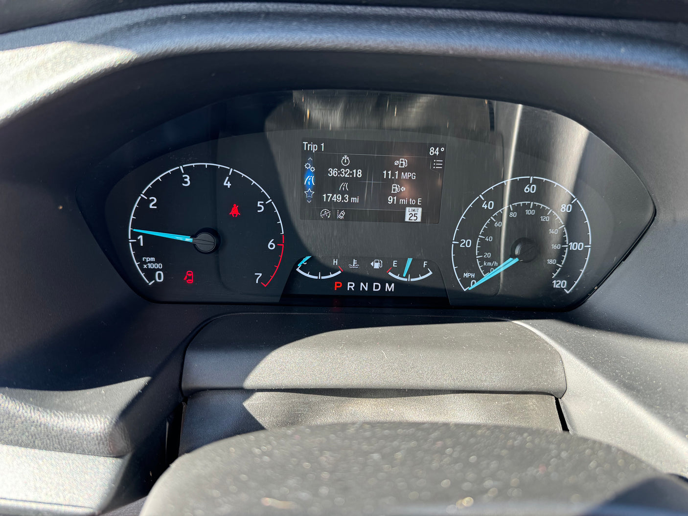 RV rental dashboard: Fuel near empty, 11.1 MPG, 84° temp. Digital display shows 91 miles range & trip data.