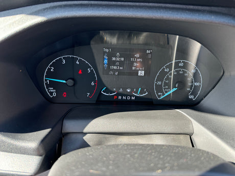 RV rental dashboard: Fuel near empty, 11.1 MPG, 84° temp. Digital display shows 91 miles range & trip data.