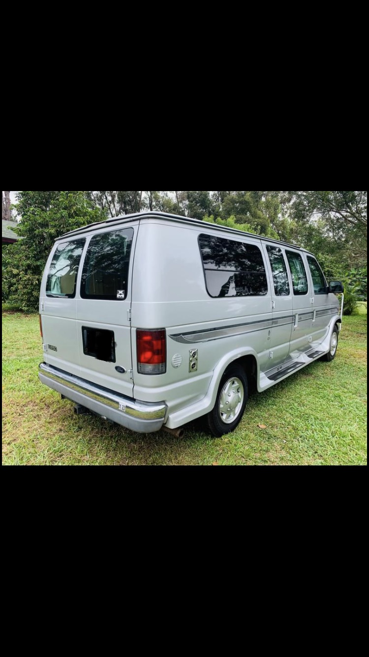 This silver Ford Econoline conversion van is perfect for an RV rental. Ready for your next travel adventure! — photo 16