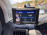 ScanGauge in an rv rental displays vehicle data: speed 0, ambient 73°F, battery 14.4V, and engine load 29.