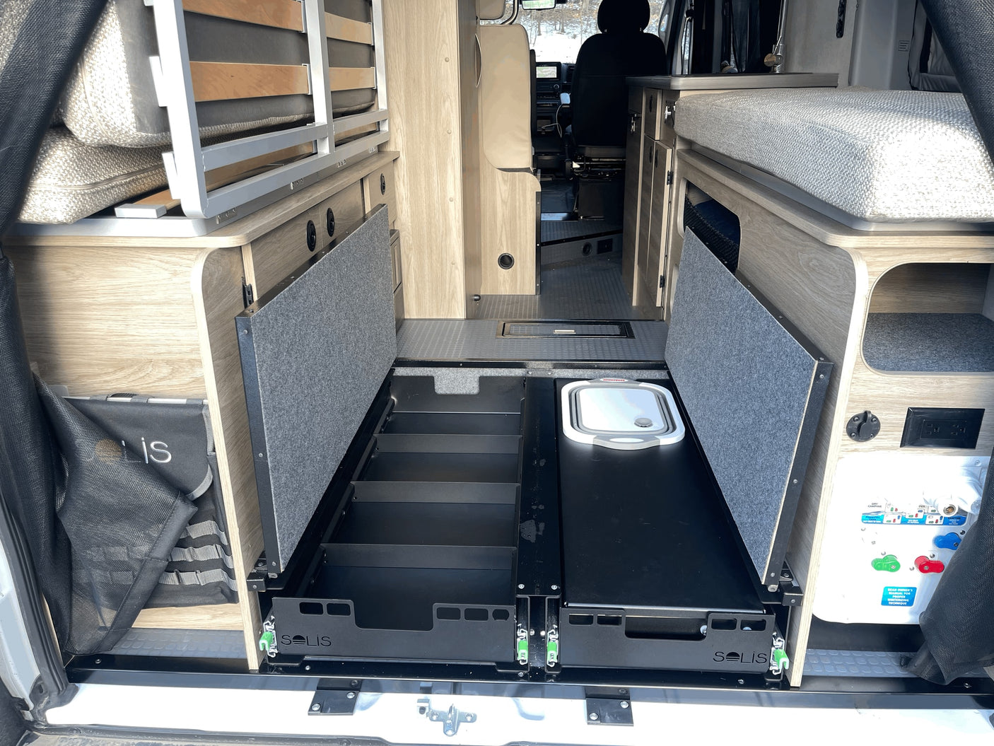  and a comfortable rear bed.|Interior of an RV rental showing a textured bed