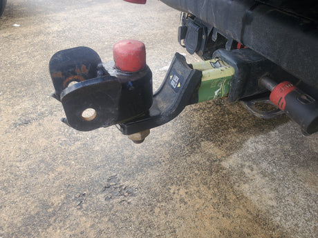 RV rental's heavy-duty trailer hitch with ball mount, electrical connector, and integrated Weigh-Safe scale. Ready for your journey.