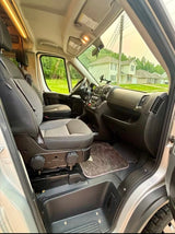 Spacious front cab of an RV rental, showing comfortable seating, dashboard, and a clear view for your next adventure.